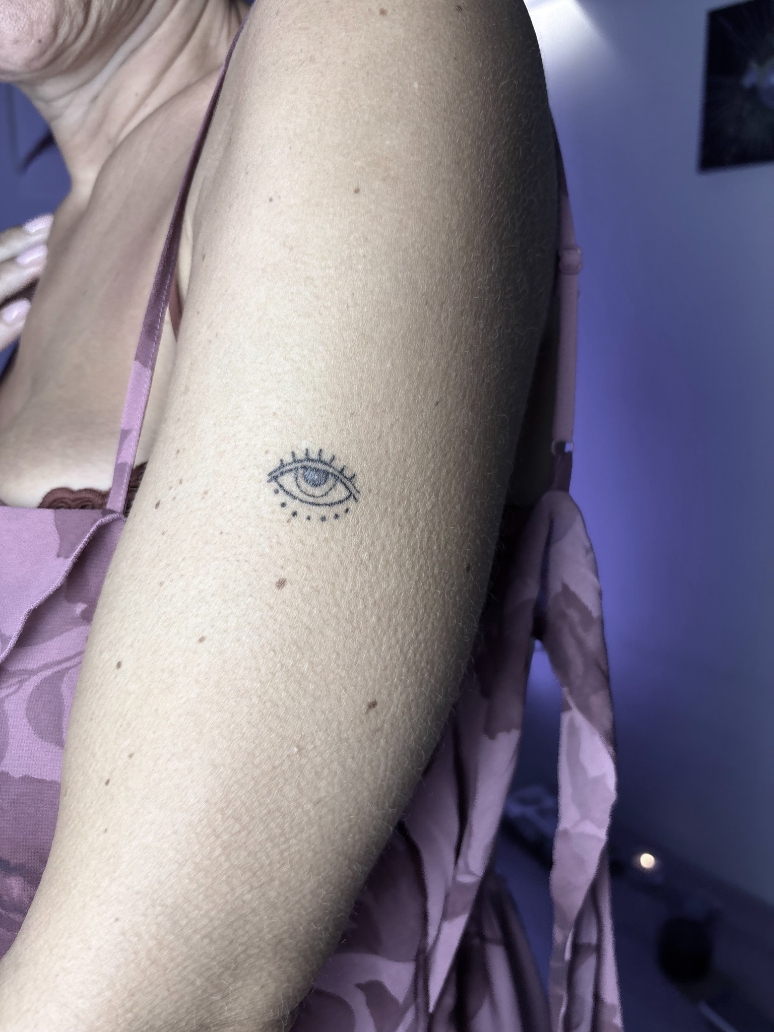 Small fine line eye tattoo, healed